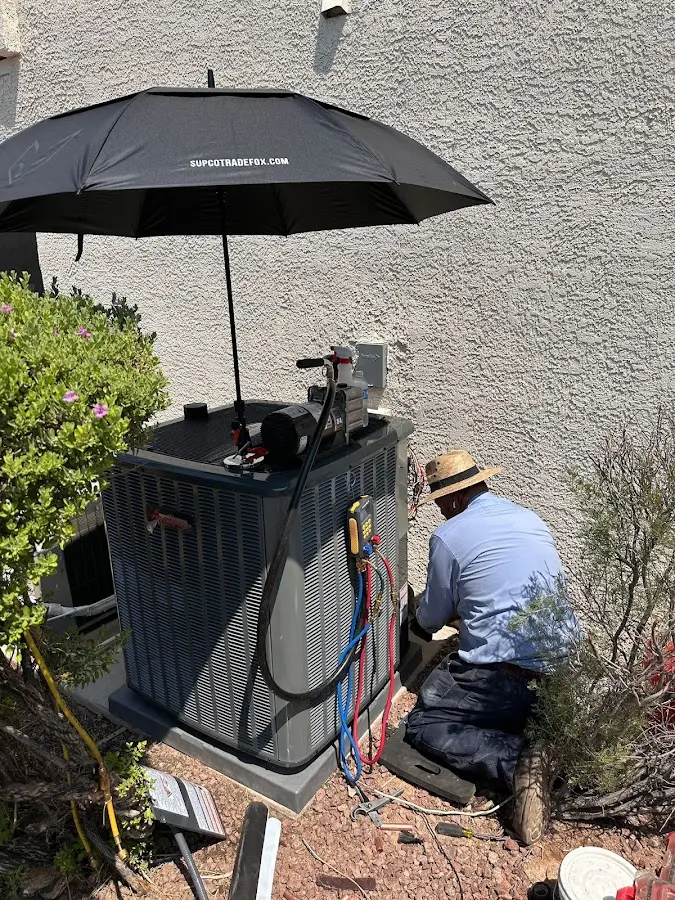 HVAC technician performing outdoor AC maintenance in Bonney Lake